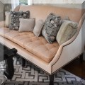 F10. Custom velvet sofa with nailhead trim. 40"h x 86"w x 40"d 